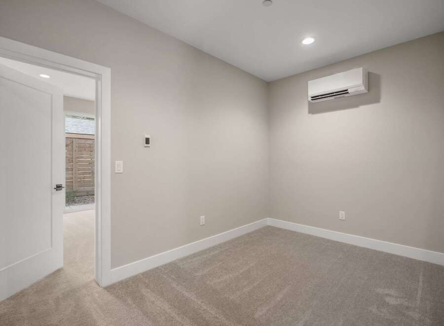 Step into this inviting room, featuring a modern split-system air conditioner for optimal climate control.