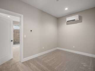 Step into this inviting room, featuring a modern split-system air conditioner for optimal climate control.