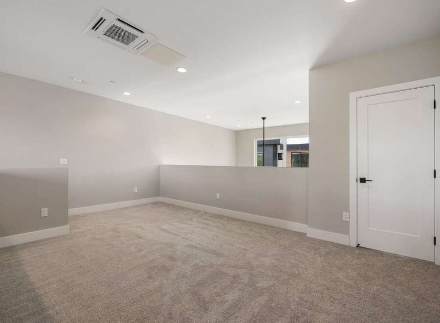 Discover this spacious loft area, perfect for a home office or additional living space.