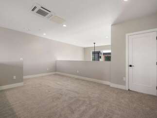 Discover this spacious loft area, perfect for a home office or additional living space.