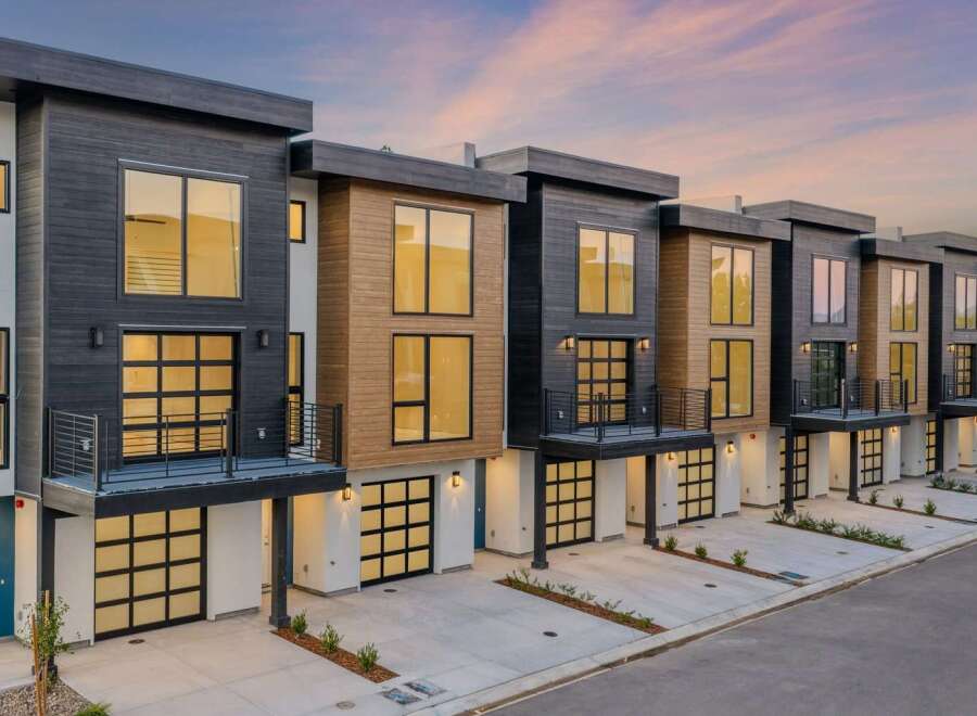Discover modern living in these stunning townhomes featuring sleek architectural design and premium finishes.