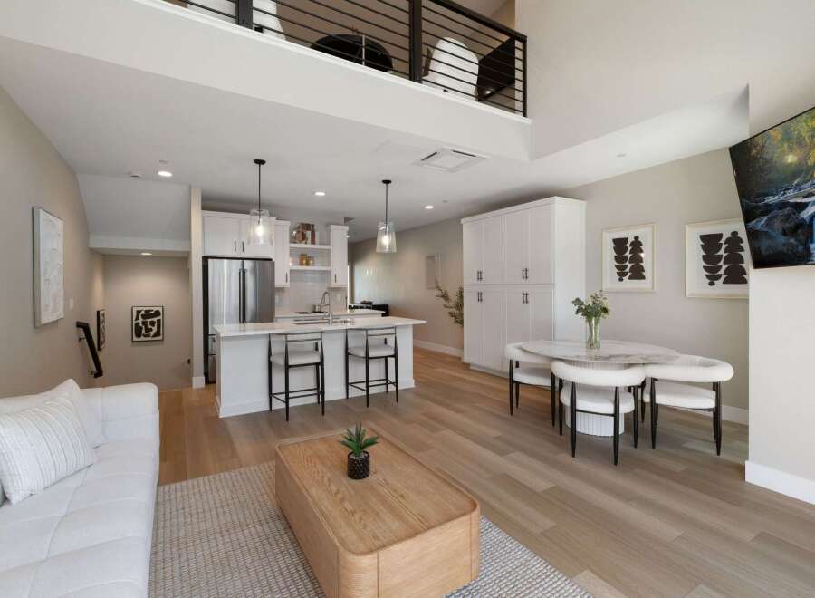 Experience modern living in this stunning loft-style apartment, featuring a sleek open-concept kitchen with stainless steel appliances and a spacious island perfect for entertaining.