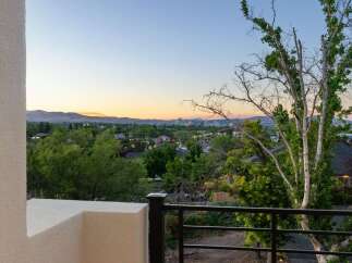 Experience breathtaking sunset views over the city skyline and rolling hills from this elevated vantage point.