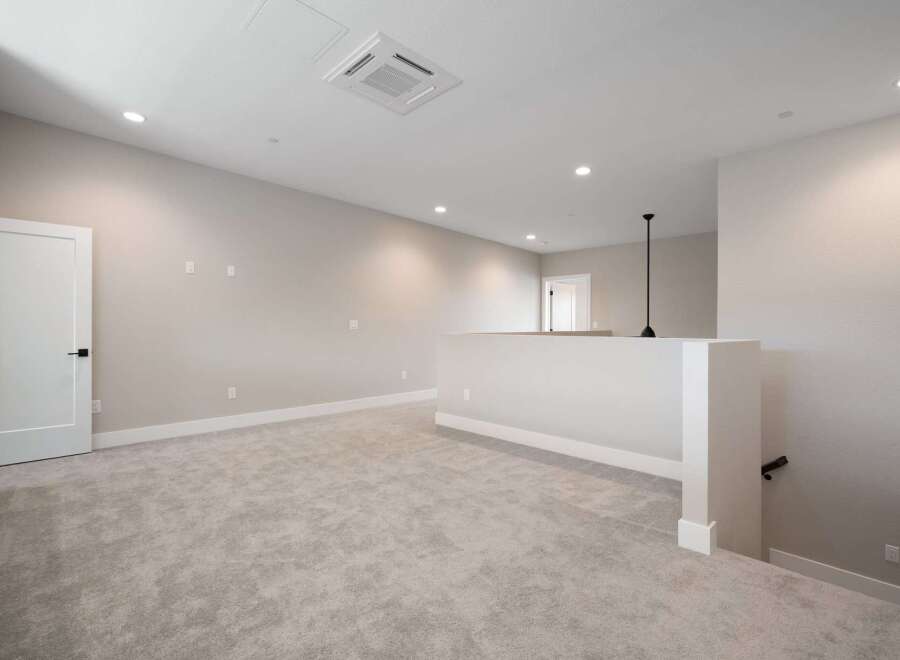 Discover this spacious loft area, perfect for a home office or secondary living space.
