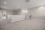 Discover this spacious loft area, perfect for a home office or secondary living space.
