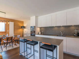Experience modern mountain living in this stunning open-concept kitchen and dining area.