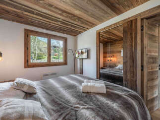 Experience rustic charm and modern comfort in this beautifully appointed bedroom.