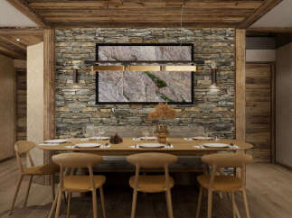 Experience rustic elegance in this dining room, featuring a striking stone accent wall that adds natural texture and warmth.