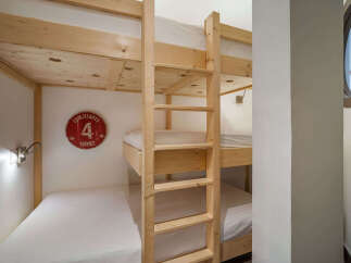 This cozy room features a space-saving bunk bed setup, perfect for families or groups.
