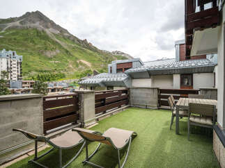 Enjoy breathtaking mountain views from this spacious balcony, perfect for relaxing or dining al fresco.
