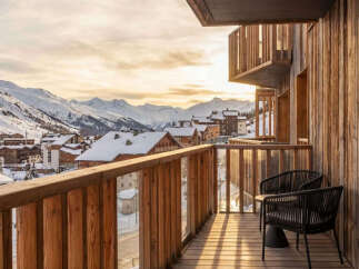 Experience breathtaking mountain views from this stunning balcony, perfect for enjoying your morning coffee or evening wine.