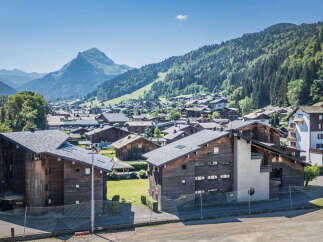 Discover this charming property nestled in a picturesque mountain village, offering stunning views of lush green slopes and snow-capped peaks.