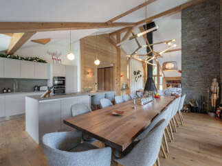 Experience luxurious mountain living in this stunning open-concept dining and kitchen area.