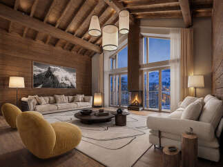 Experience luxurious mountain living in this stunning chalet, featuring a grand living area with a soaring wood-beamed ceiling and a magnificent stone fireplace.