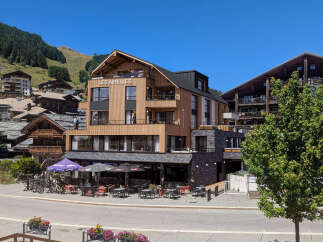 Discover luxury mountain living at Les Airelles, a stunning property nestled in a picturesque alpine village.