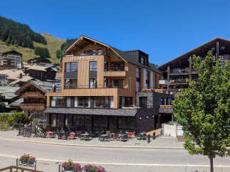 Discover luxury mountain living at Les Airelles, a stunning property nestled in a picturesque alpine village.