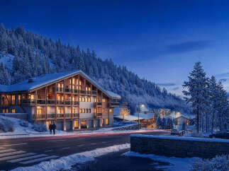 Experience luxurious mountain living in this stunning chalet-style property nestled amidst snow-covered pines.
