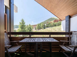 Enjoy breathtaking mountain views from this charming balcony, perfect for your morning coffee or evening relaxation.
