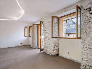 Discover this charming unfinished interior space, perfect for renovation.