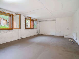 This unfinished basement room offers a blank canvas for your dream home.