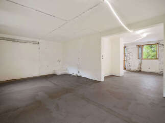 This spacious, unfinished room offers a blank canvas for your dream home renovation.