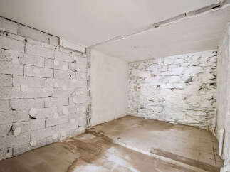 This unfinished interior space offers a blank canvas for your renovation dreams.