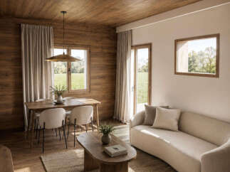 Experience cozy living in this beautifully appointed room featuring a warm wooden ceiling and walls, complemented by a comfortable sofa and a dining area.
