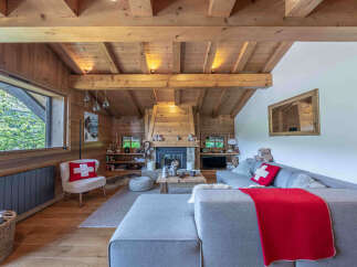 Experience cozy mountain living in this charming wooden chalet living room.