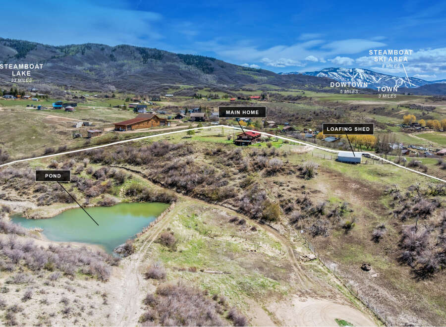 Discover your dream mountain retreat with this stunning property offering a serene pond and a charming main home.