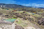 Discover your dream mountain retreat with this stunning property offering a serene pond and a charming main home.