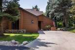 Discover this charming home featuring a warm brown exterior and a welcoming entrance.