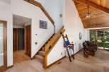 Discover this charming home featuring a beautiful wooden staircase leading to the upper level.