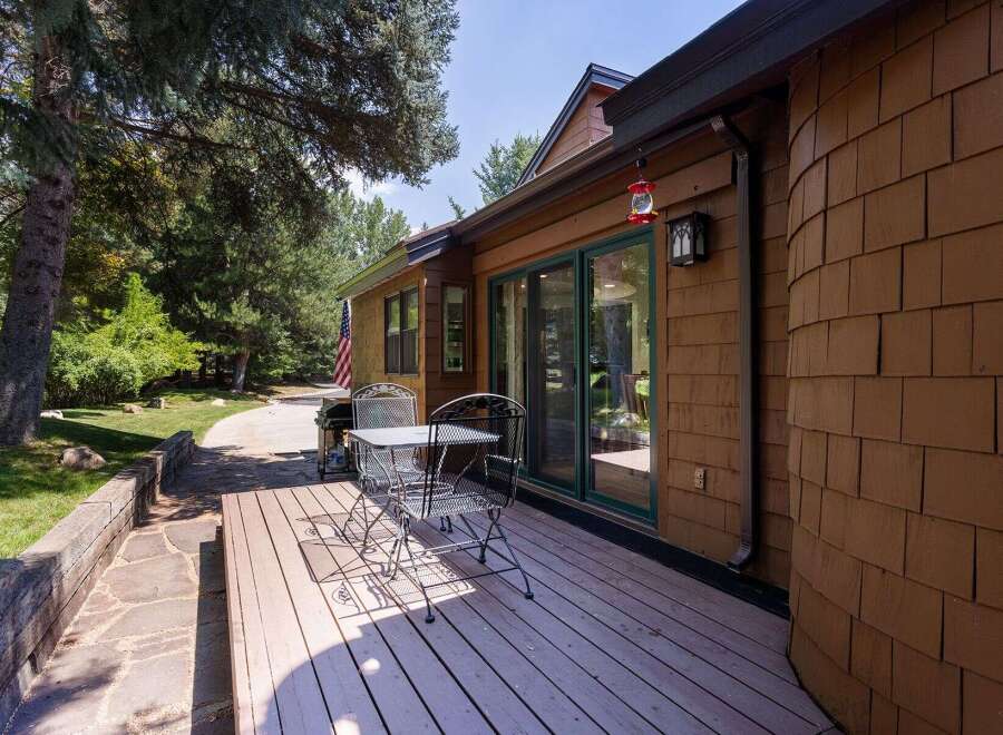 Enjoy outdoor living on this charming deck, perfect for morning coffee or evening relaxation.