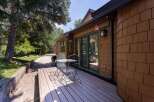 Enjoy outdoor living on this charming deck, perfect for morning coffee or evening relaxation.