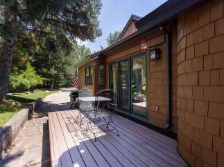 Enjoy outdoor living on this charming deck, perfect for morning coffee or evening relaxation.