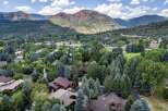 Nestled amidst lush greenery and mature trees, this property offers a serene mountain retreat.