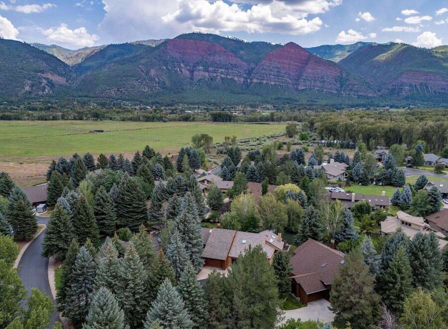 Nestled amidst a lush forest and offering breathtaking mountain views, this property provides a serene and private retreat.