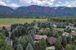 Nestled amidst a lush forest and offering breathtaking mountain views, this property provides a serene and private retreat.
