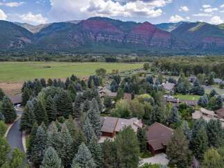 Nestled amidst a lush forest and offering breathtaking mountain views, this property provides a serene and private retreat.