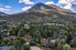 Nestled amidst a lush forest and overlooking a majestic mountain, this property offers a serene and private retreat.