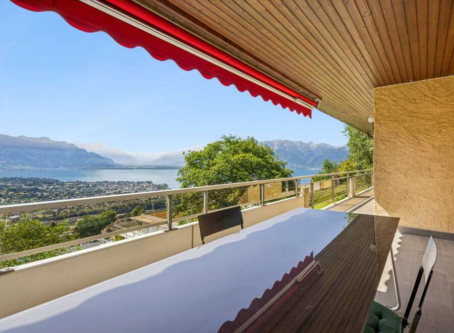 Enjoy breathtaking panoramic views of the lake and mountains from this stunning balcony.