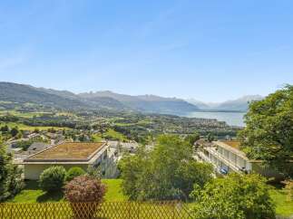 Experience breathtaking panoramic views of the lake and mountains from this stunning property.