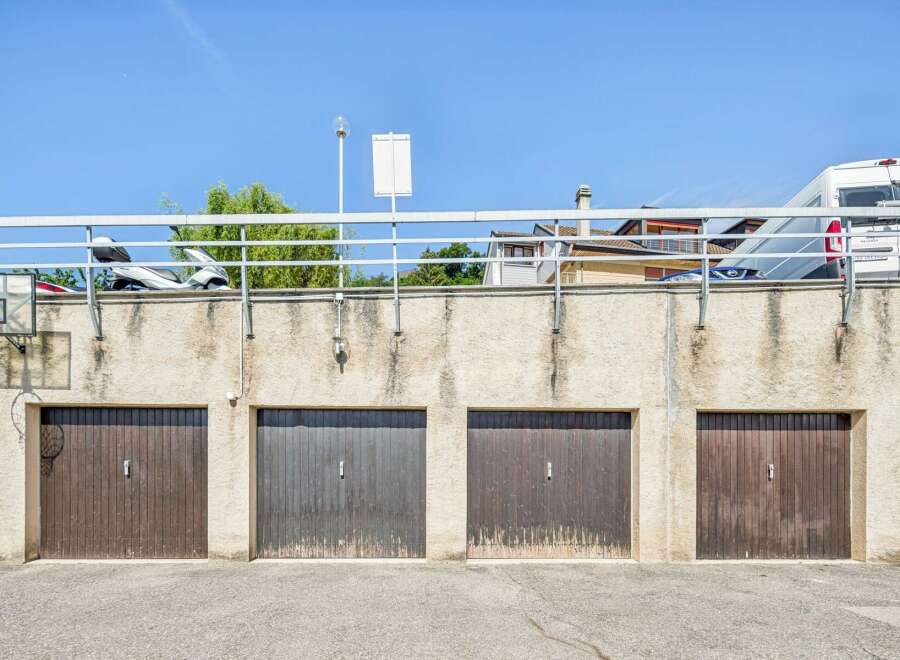 Discover secure and convenient parking with this set of four garage doors, perfect for protecting your vehicles.