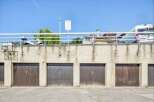 Discover secure and convenient parking with this set of four garage doors, perfect for protecting your vehicles.