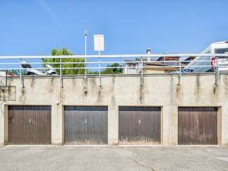 Discover secure and convenient parking with this set of four garage doors, perfect for protecting your vehicles.