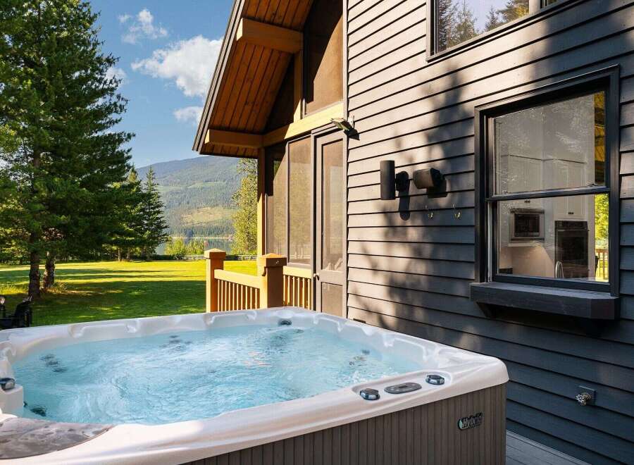 Experience ultimate relaxation in this luxurious hot tub, perfectly situated on a private deck with stunning mountain and lake views.