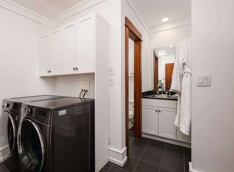 This laundry room and powder room combination offers ultimate convenience and style.