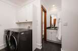 This laundry room and powder room combination offers ultimate convenience and style.