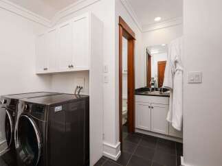 This laundry room and powder room combination offers ultimate convenience and style.