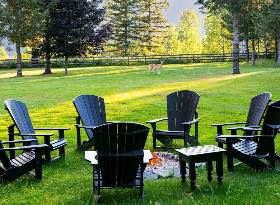 Experience serene outdoor living with this inviting fire pit area, perfect for gathering with loved ones.